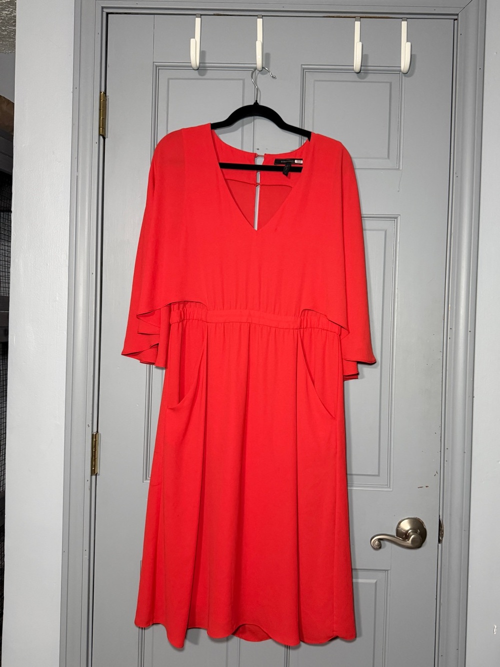 BCBGMaxAzria Coral-Red Midi Dress with V-Neck and Flutter Sleeves